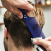 Barber using Fade Comb to cut hair