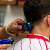 Barber using Barber Brush on client's hair