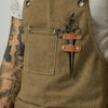 Brown work apron with a pair of scissors