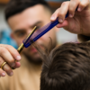 Barber using Hair Cutting Comb to cut hair