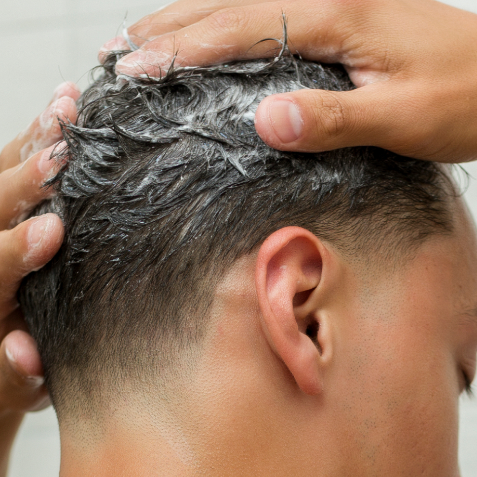 Model washing hair with All Over Shampoo